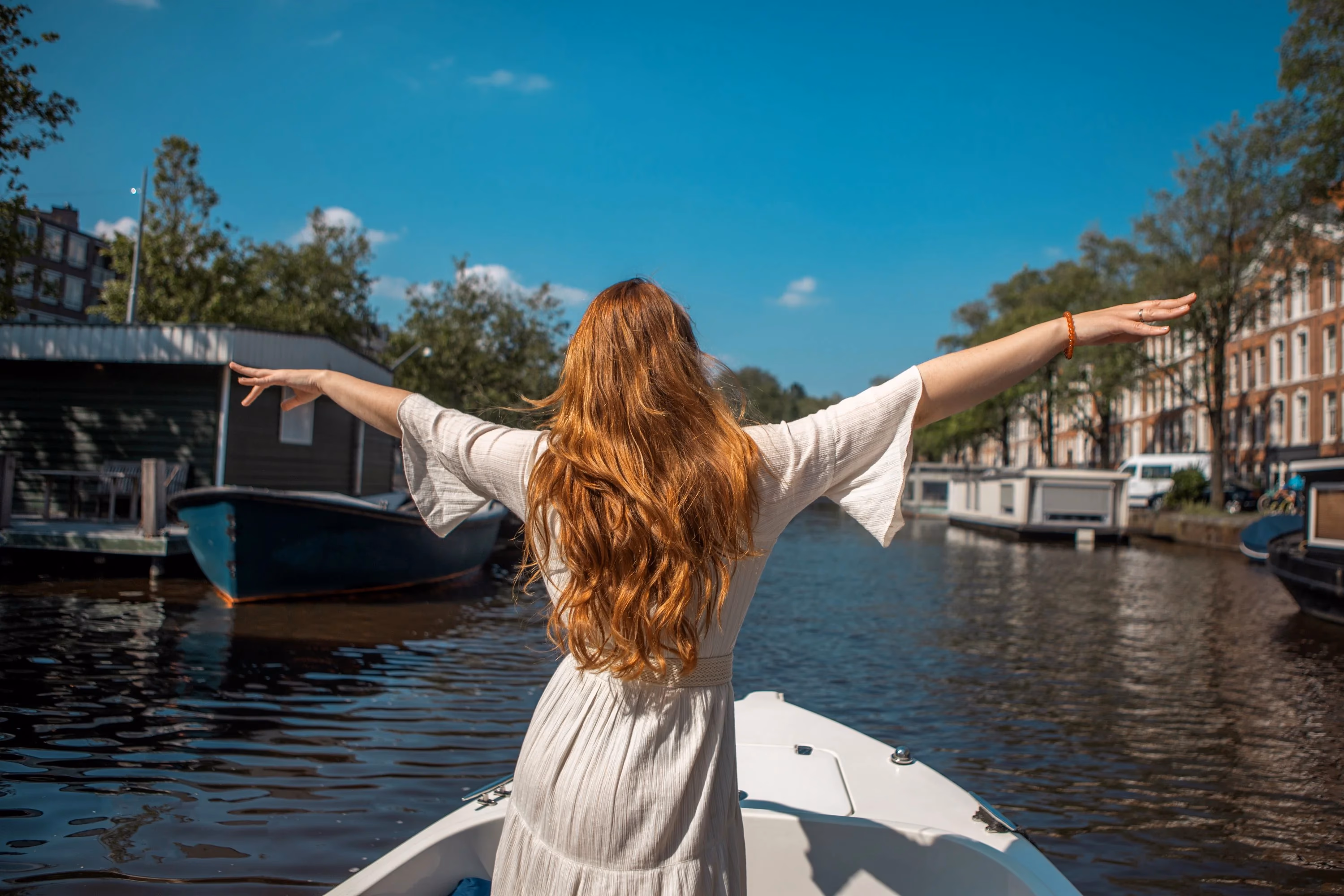 Girl stands on the boat